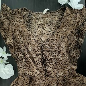 Pretty, sheer, tiger print sleeveless top. Size M.